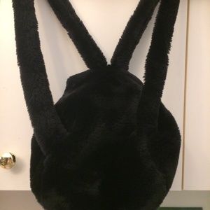 NWOT Fun Faux Fur back pack with matching wallet.